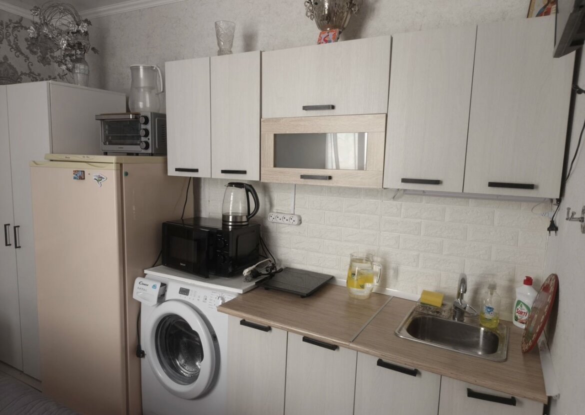Before: Kitchen — lighting, declutter